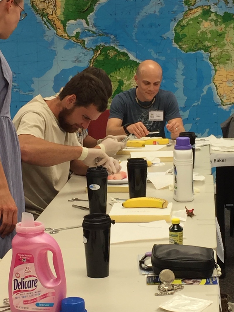 Lance suturing a banana