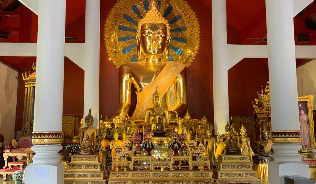 A golden statue inside a Thai temple